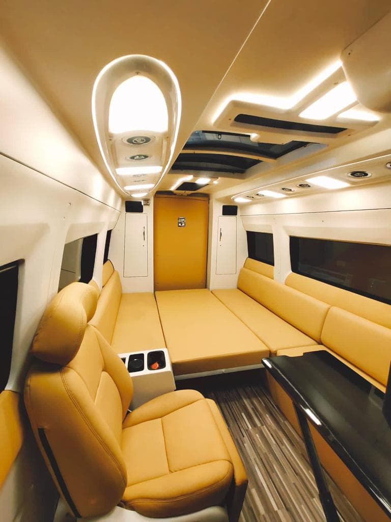 Camper caravan interior with kitchenette and seating